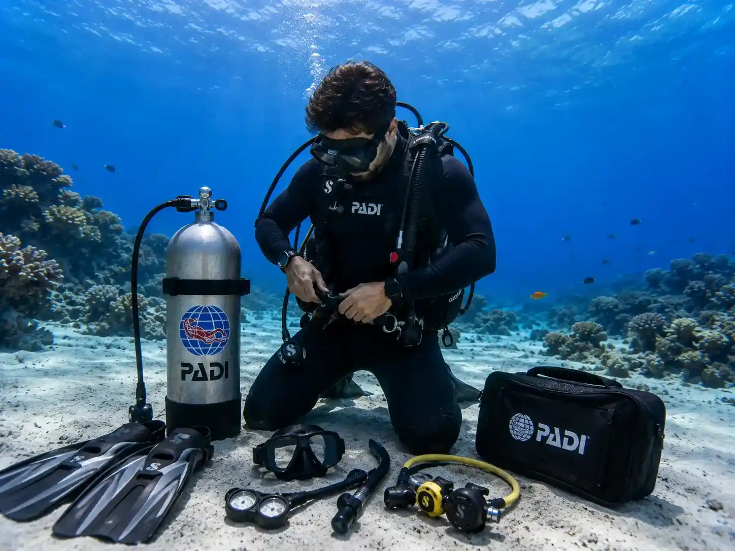 PADI Open Water student learning scuba equipment assembly in Hurghada